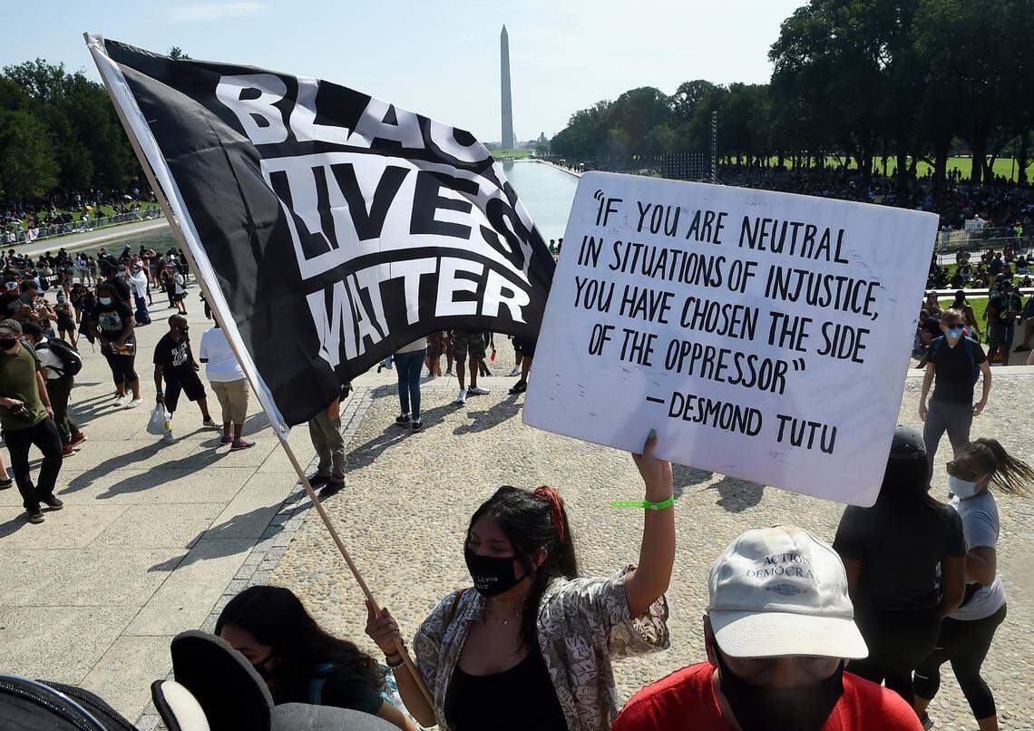 Demonstrators gather near the Lincoln Memorial as final preparations are made for the March on Washington, Friday Aug. 28, 2020, in Washington, on the 57th anniversary of the Rev. Martin Luther King Jr.’s “I Have A Dream” speech. (Olivier Douliery/Pool via AP)