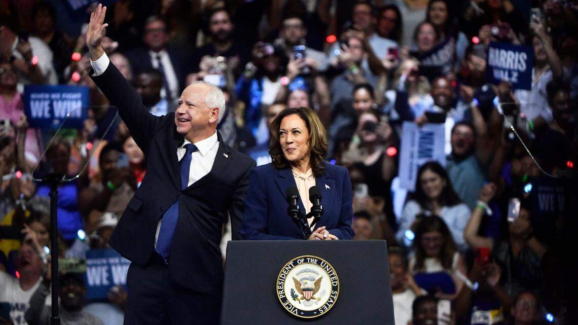 Vice President Kamala Harris stands with her running mate Minnesota Gov. Tim Walz during a rally at Temple University in Philadelphia on Tuesday, Aug. 6, 2024.