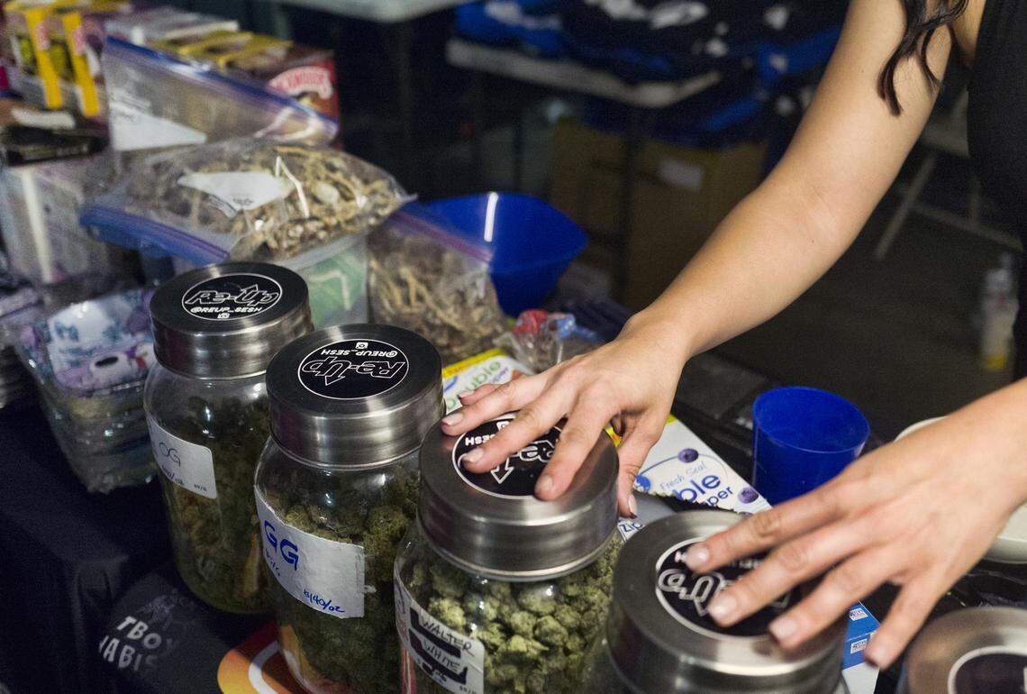 Bags of psilocybin mushrooms, left, are seen displayed at a pop-up cannabis market in Los Angeles on May 6, 2019.