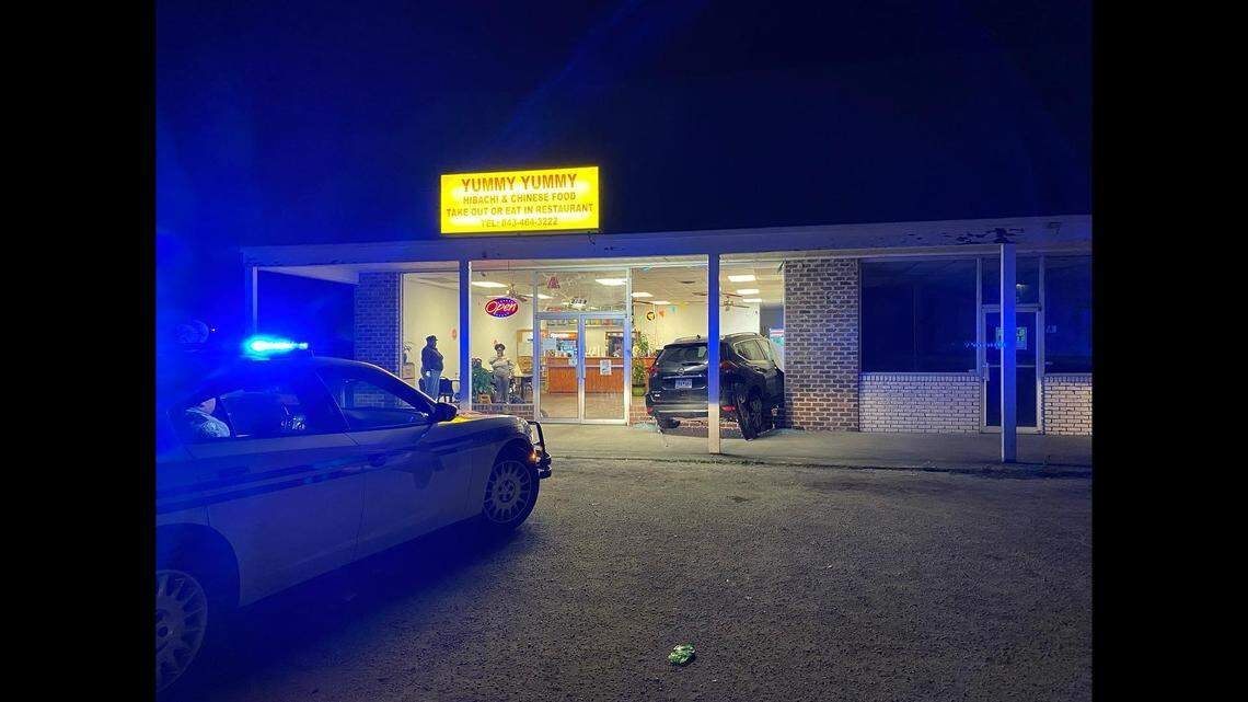 A vehicle crashed through a window of a restaurant, injuring two police officers eating inside, South Carolina officials said.