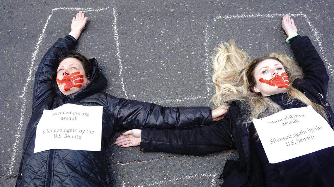 Women opposing Brett Kavanaugh’s Supreme Court nomination lay in the streets near Portland’s federal courthouse Thursday spelling “STOP HIM” with their bodies.