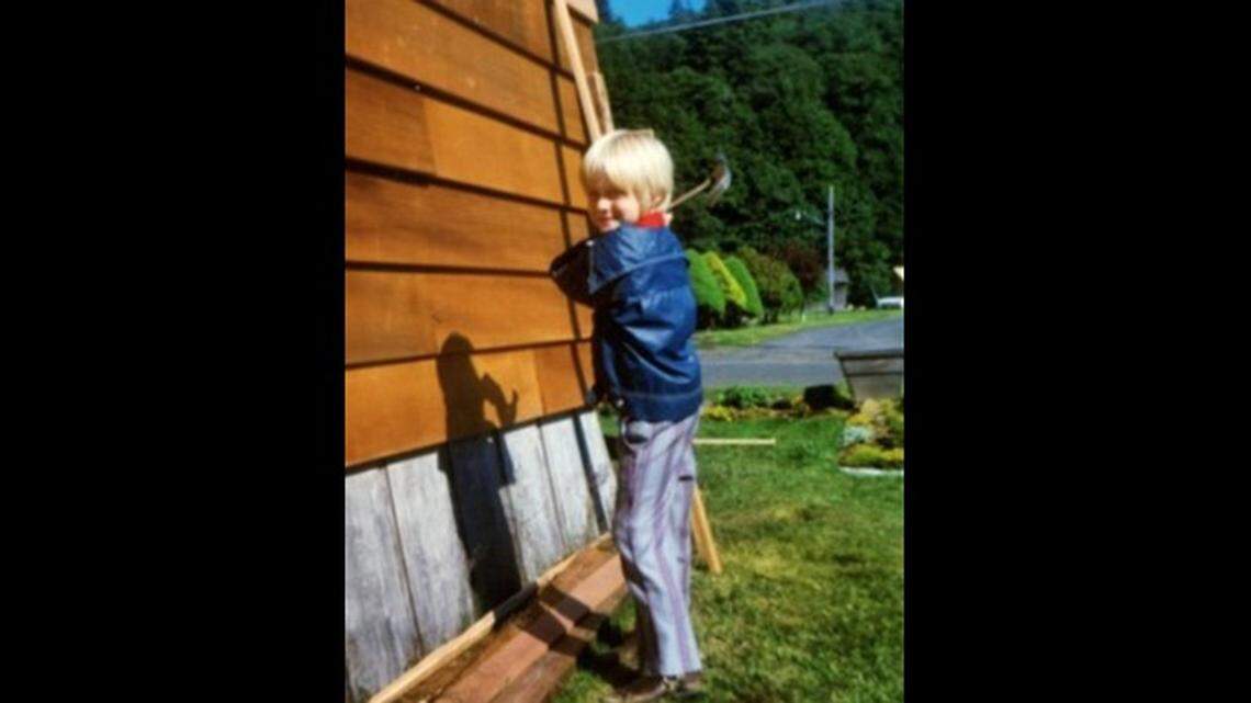 Kurt Cobain at his family home in Aberdeen, Washington, helping to install new cedar siding in about 1973.
