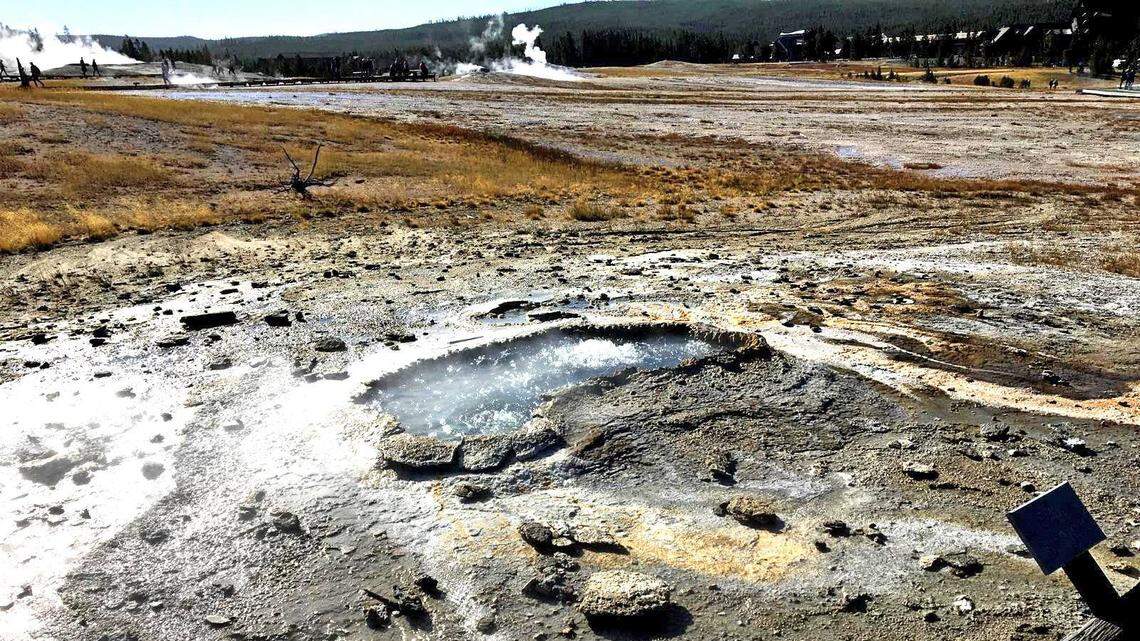 After its Sept. 15 eruption, a photo shows Ear Spring hot spring in Yellowstone still boiling the next day, with rocks and other debris scattered after the ejection shot them out of the spring, according to the U.S. Geological Survey.