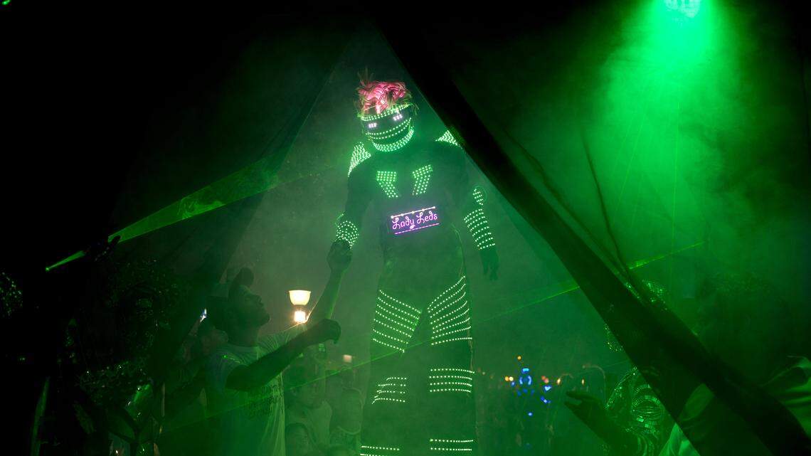 In this Feb. 12, 2016 photo, an alien enthusiast in an illuminated costume arrives for a parade at the annual Alien Festival in Capilla del Monte, Cordoba, Argentina, the site of an alleged UFO sighting 30 years ago. Thousands of earthlings gathered for the festival in this central Argentine town which has become a global hot spot for UFO sightings.