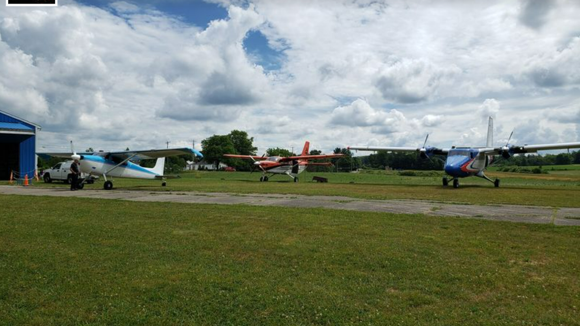 Two skydivers became tangled in the air and crashed through the roof of a building on the property of the Cleveland Skydiving Center, media outlets reported.