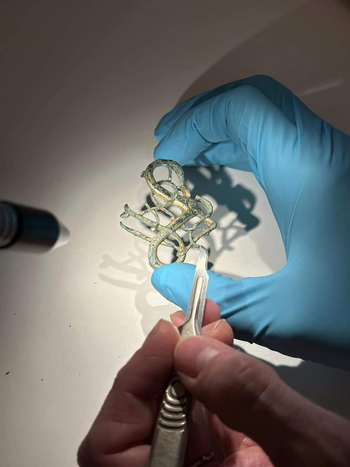 The artifact was cleaned using a micro-blade.