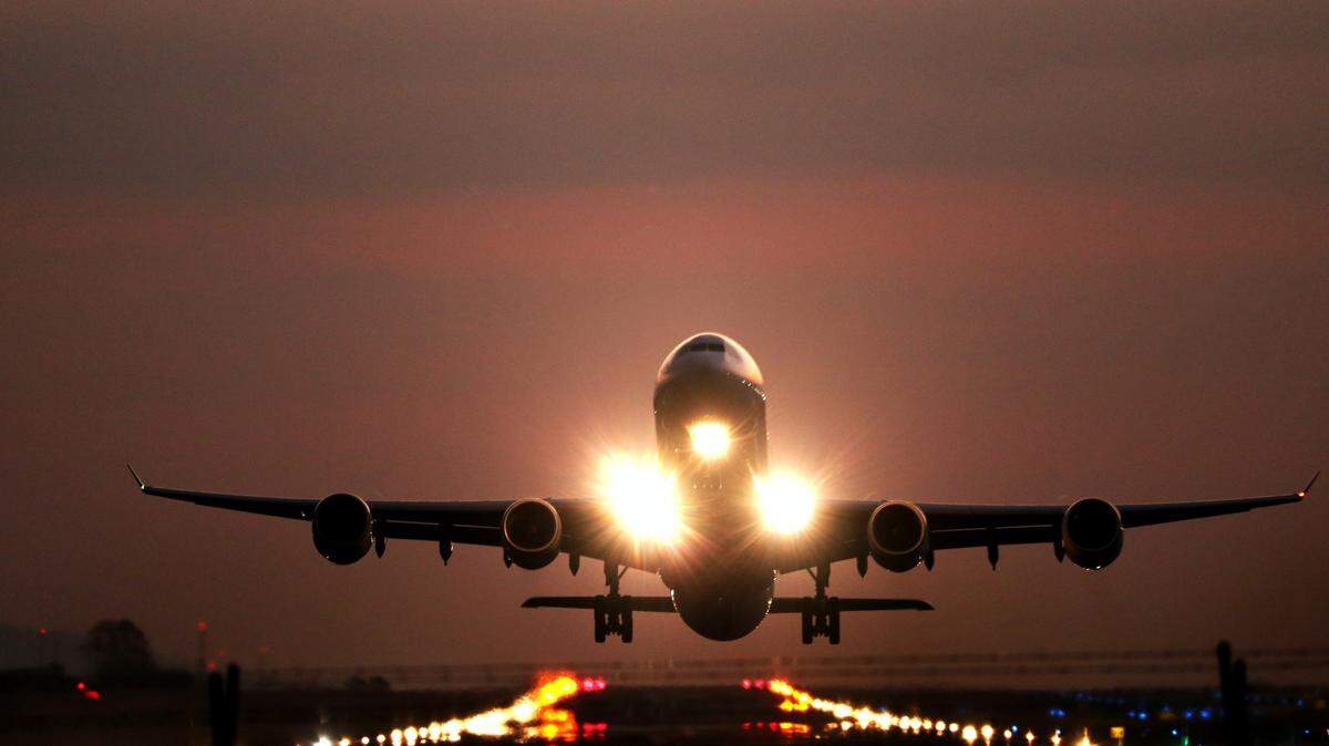 The 52-year-old man had a loaded assault rifle and 163 rounds of ammunition in his carry-on bag, officials said.