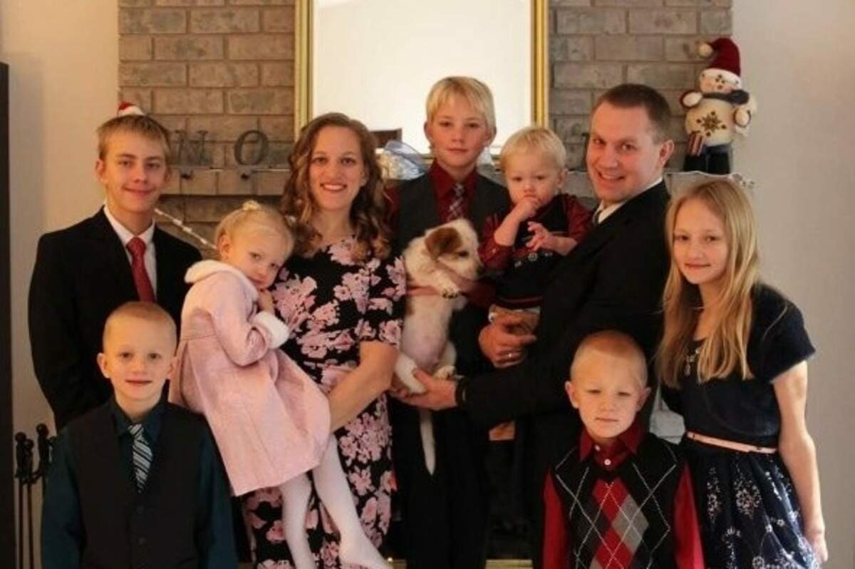Travis and Denay Tubbs, and their seven children, have lived in a garage on their property for much of the last year and expect to live there for at least six more months.