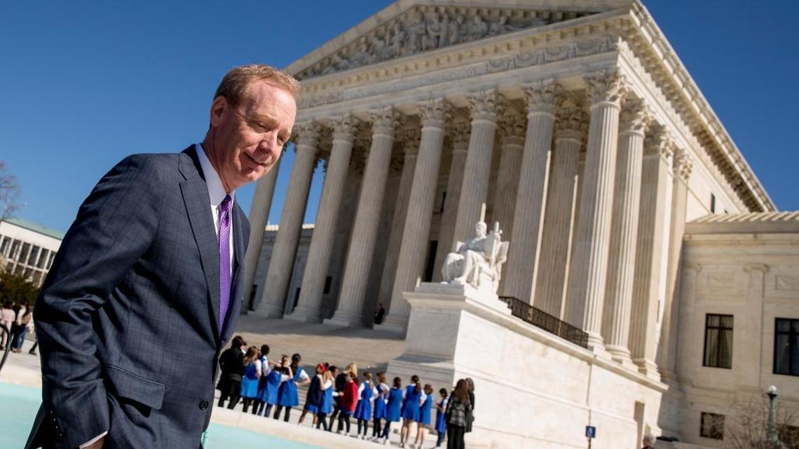 Microsoft President Brad Smith leaves the Supreme Court Tuesday after observing oral arguments before the high court in a dispute over emails that were sought as part of a drug trafficking investigation. Microsoft stores the emails at a data center in Ireland.