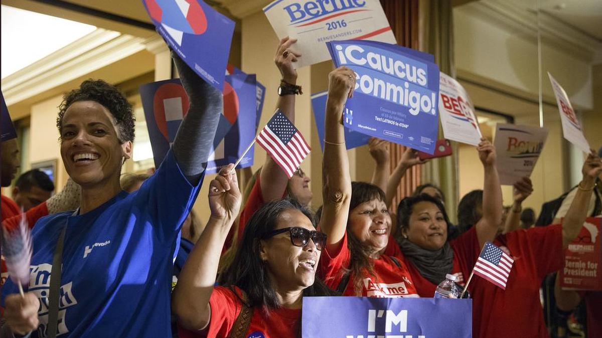 Caucus participants support their chosen candidate at Caesars Palace in Las Vegas, Feb. 20, 2016.