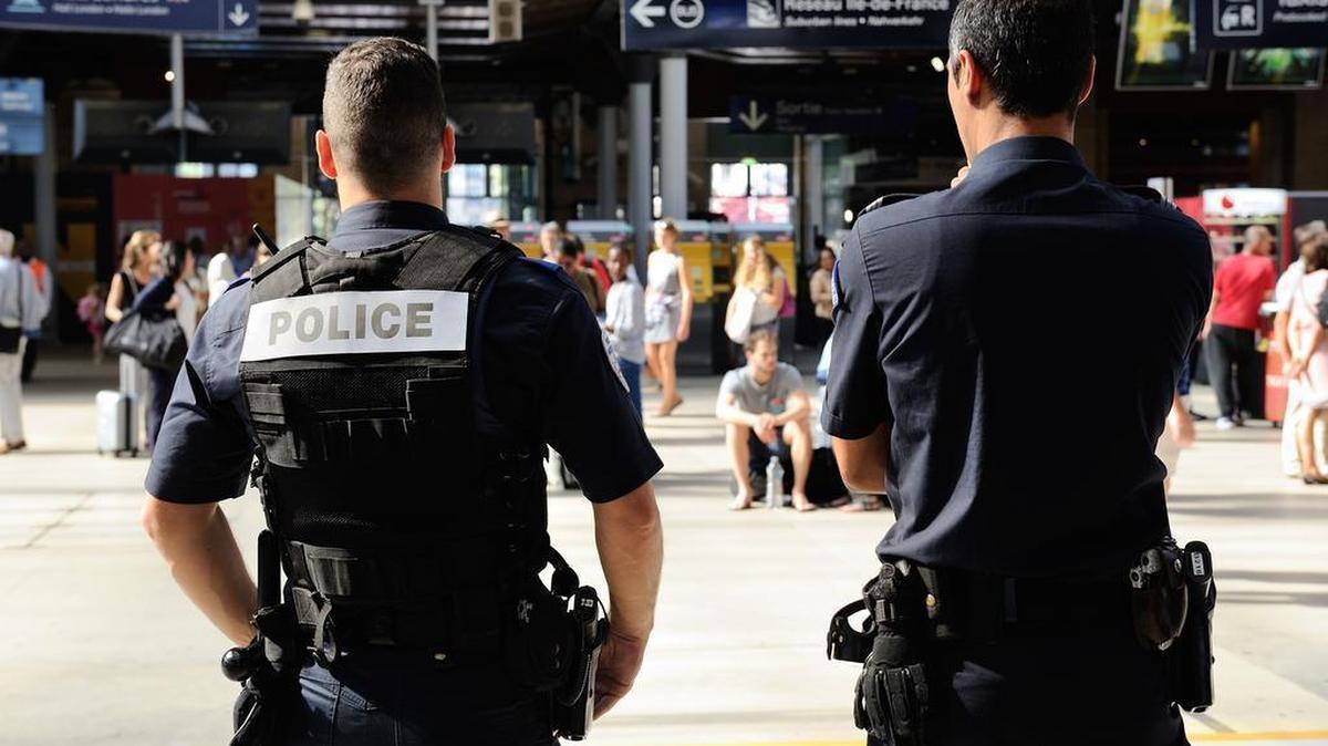 
French police officers patrol at Gare du Nord train station in Paris on Saturday, Aug. 22, 2015. A gunman prepared to open fire with an automatic weapon on a high-speed train traveling from Amsterdam to Paris on Friday, wounding several people before being subdued by passengers, officials said. 
