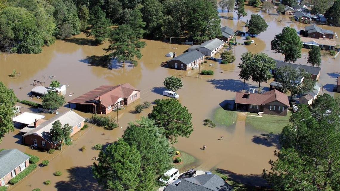 Flood waters surround several houses in Rocky Mount, N.C., near the Tar River Monday afternoon, Oct. 10, 2016. Heavy rains from Hurricane Matthew caused extensive flooding across eastern North Carolina last year.