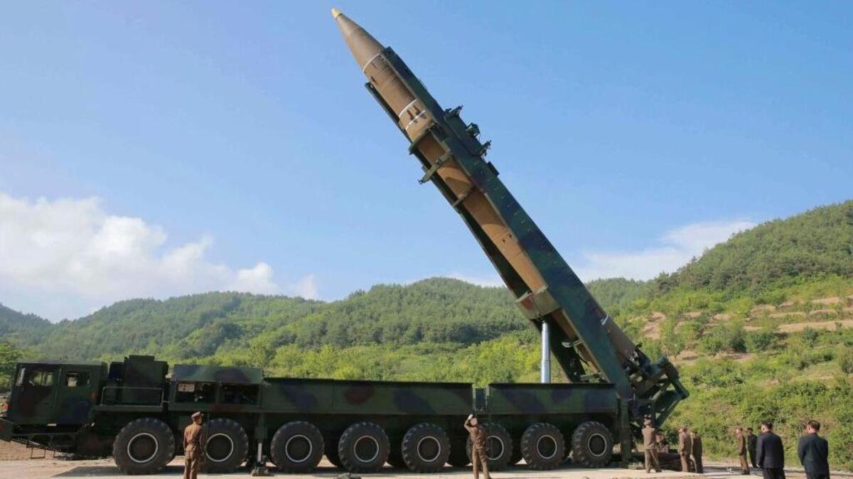 North Korean leader Kim Jong Un, second from right, inspects a Hwasong-14 intercontinental ballistic missile in North Korea’s northwest in this July 4 file photo, distributed by the North Korean government. As North Korea advances its weapons systems, an increasing number of South Korean lawmakers say the south should develop its own nuclear arsenal.