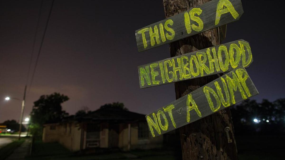 
A hand-made sign at North Rocheblave and Lamanche Streets in the Lower Ninth Ward of New Orleans attempts to thwart the illegal dumping of tires and industrial waste on Friday, Aug. 14, 2015.
