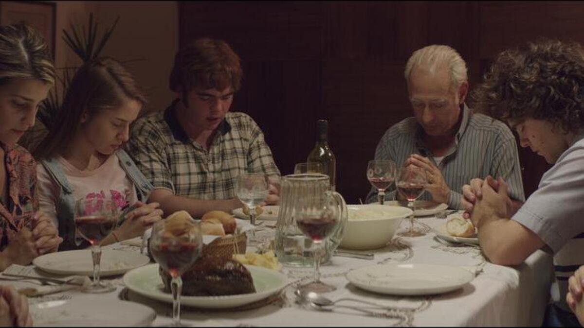 
Actors playing the members of the Puccio family pray before dinner during the film The Clan by Argentine filmmaker Pablo Trapero. Over the course of about three years, members of the family killed at least three people they had kidnapped for ransom. A fourth victim was freed after being held in chains in a basement cell of the Puccio home.
