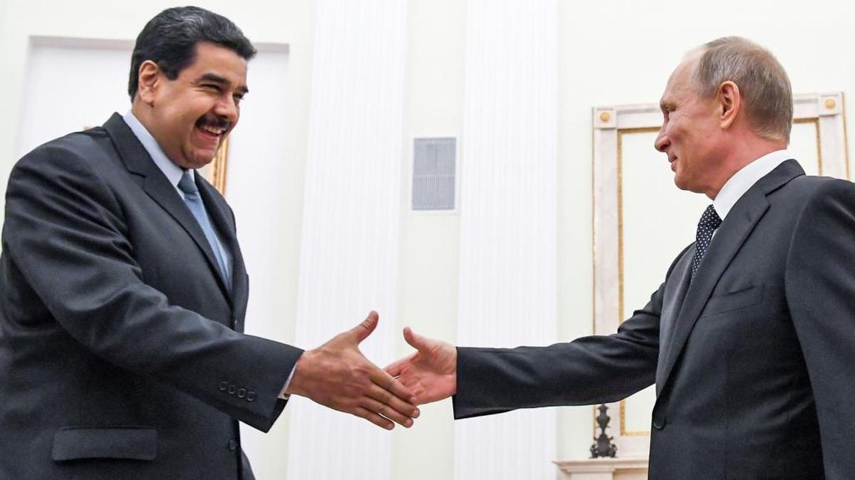 Russian President Vladimir Putin, right, greets Venezuela's President Nicolas Maduro during their meeting at the Kremlin in Moscow, Russia, Wednesday, Oct. 4, 2017.