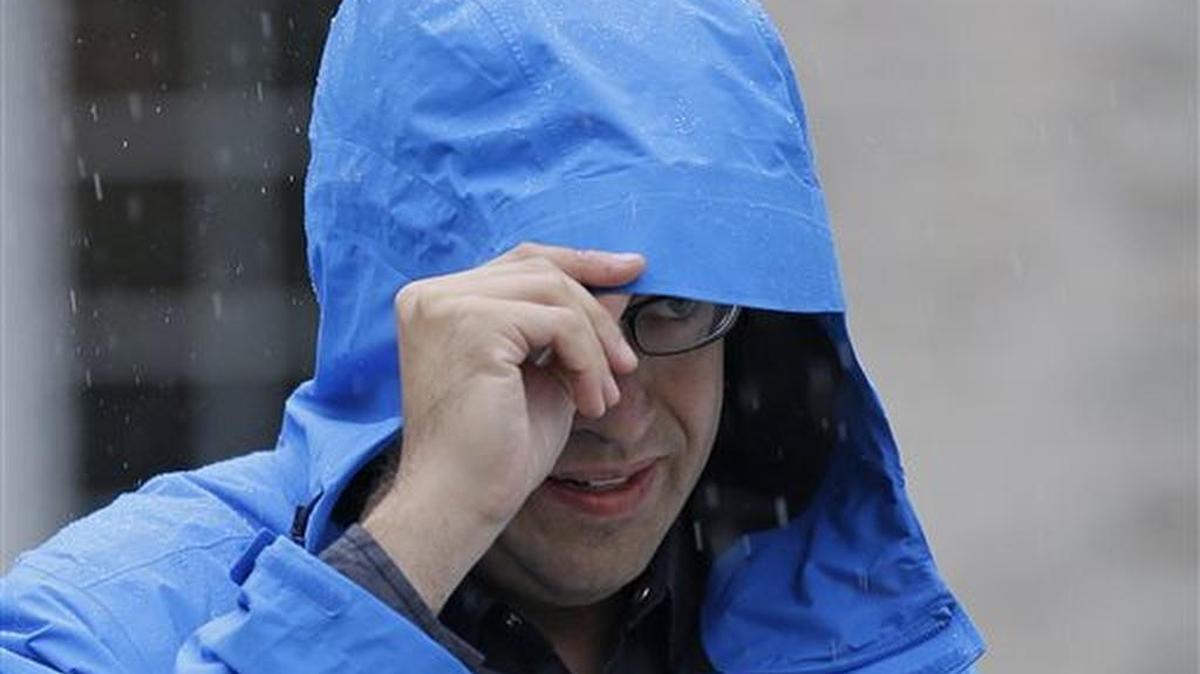 
In this July 7, 2015, file photo, Subway restaurant spokesman Jared Fogle walks to a waiting car as he leaves his home in Zionsville, Ind. 
