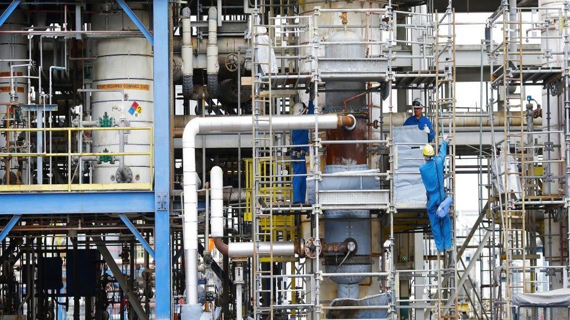 Workers conduct maintenance amid the pipes, chemical tanks and reactors at REC Silicon, a plant in Moses Lake, Wash., that employs 280 employees. REC Silicon makes polysilicon, a key component in solar panels. China was once its largest customer.