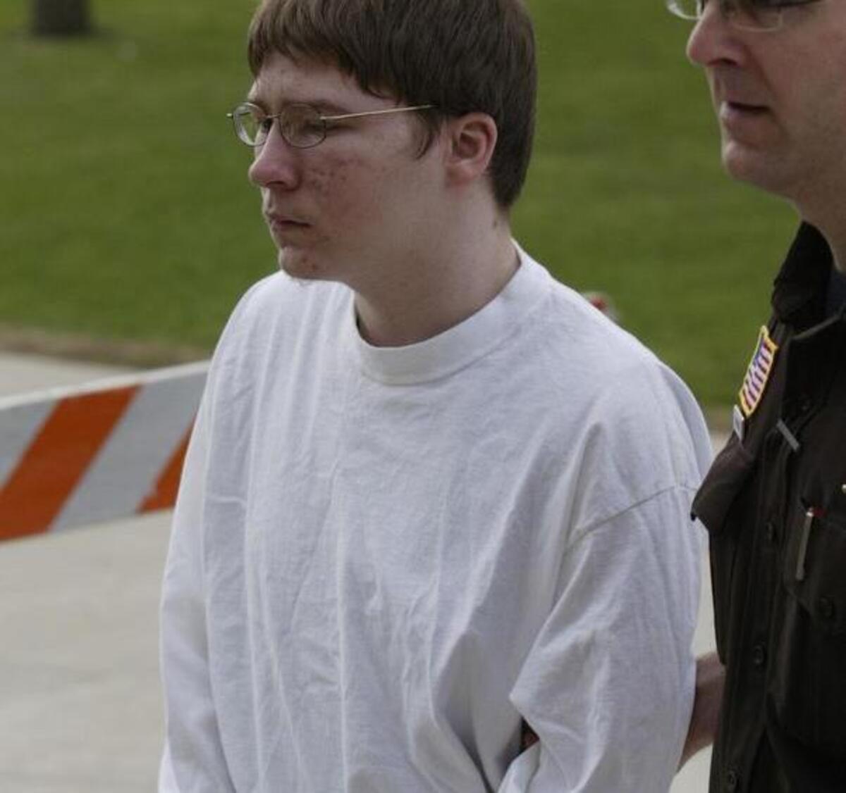 Brendan Dassey is led into the Manitowoc County Courthouse Tuesday, April 24, 2007, in Manitowoc, Wis. He was on trial for the Oct. 31, 2005, killing of Teresa Halbach. His uncle, Steven Avery was convicted of the same crime in March.