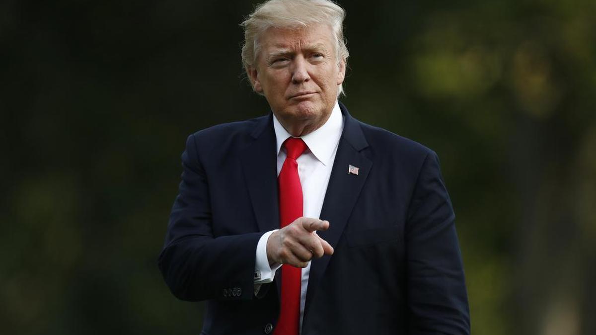President Donald Trump walks from Marine One across the South Lawn to the White House in Washington, Wednesday, Aug. 30, 2017, as he returns from Springfield, Mo.