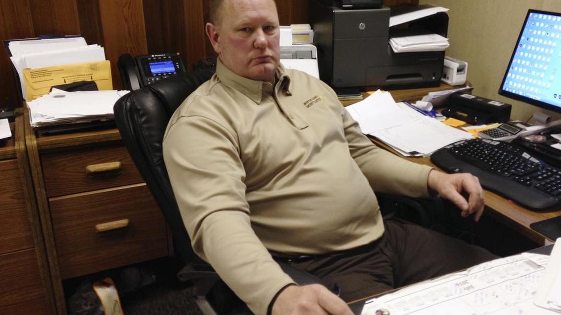 Morton County Sheriff Kyle Kirchmeier looks up from his desk in Mandan, N.D., Tuesday, Nov. 22, 2016. Kirchmeier has led the police response to the Dakota Access oil pipeline protests, and shrugs off criticism that that response has been heavy-handed at times, saying that he and his officers have properly enforced the law against protesters whose tactics have become increasingly aggressive.