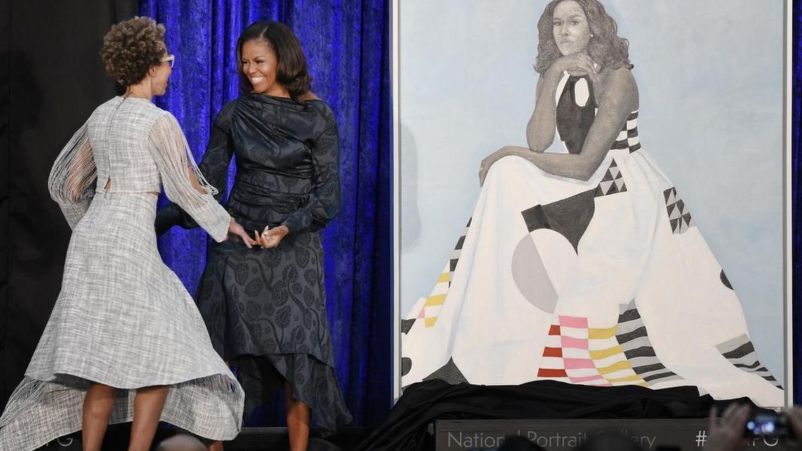 Former first lady Michelle Obama with artist Amy Sherald unveils her official portrait at the National Portrait Gallery on February 12, 2018 in Washington, D.C.