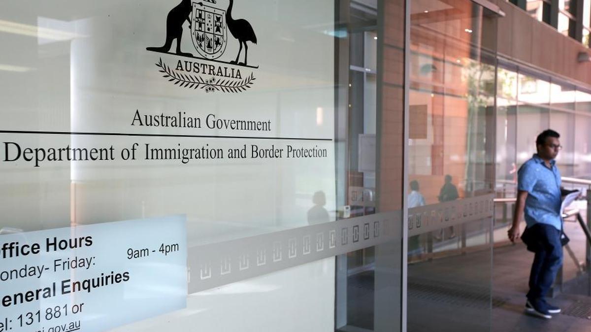 A man leaves the Department of Immigration and Border Protection offices in Sydney.