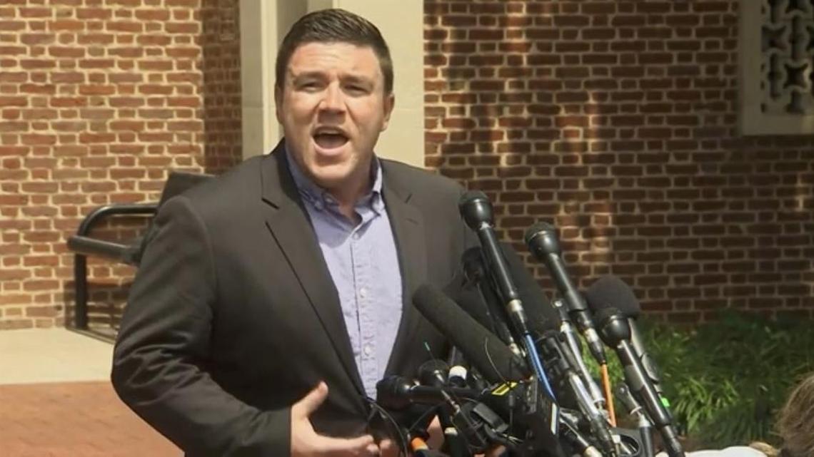 Jason Kessler —seen here speaking to the media on Aug. 13, 2017 before a crowd booed him and forced him away from the lectern —was verified by Twitter on Tuesday.