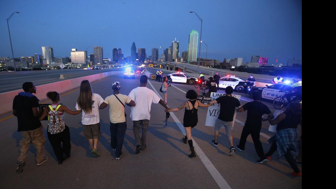 
Protestors march across Margaret Hunt Hill Bridge which police shut down to traffic, during a march in Dallas on Friday, May 1, 2015. The Texas Organizing Project (TOP), Mothers Against Police Brutality (MAPB), and allies hosted a peaceful march to show unity in the call for justice for the immigrant, Latino and African American communities, including some with signs reading “Black Lives Matter,” others honoring Freddie Gray or Michael Brown of Ferguson, and more.
