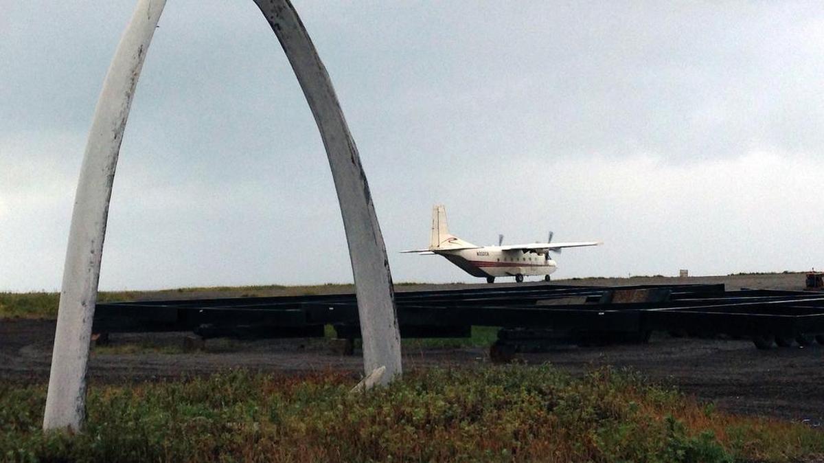 
One of the planes that takes people between Kivalina, Alaska, and the mainland a few times a day takes off from the tiny runway. Beside it is an arch of whale ribs, a traditional tribute to the annual hunt. 
