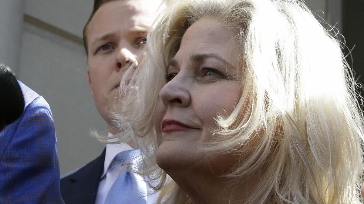 Sandra Merritt, one of the two anti-abortion activists indicted last month, stands outside the courthouse after turning herself in to authorities and bonding out Wednesday in Houston. Merritt and David Daleiden are charged with tampering with a governmental record, a felony punishable by up to 20 years in prison.