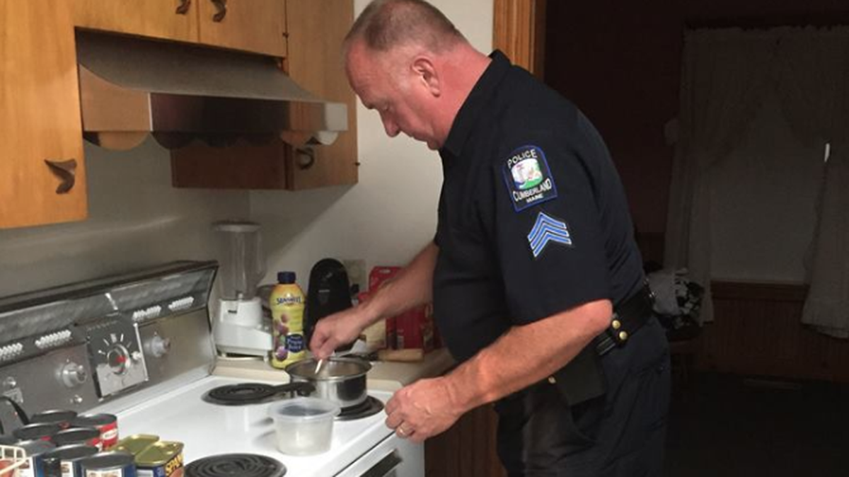 Sgt. Thomas Burgess of the Cumberland Police Department in Maine cooks a meal for a local resident he had checked in on, only to realize the man hadn’t eaten in a day and was running low on food.