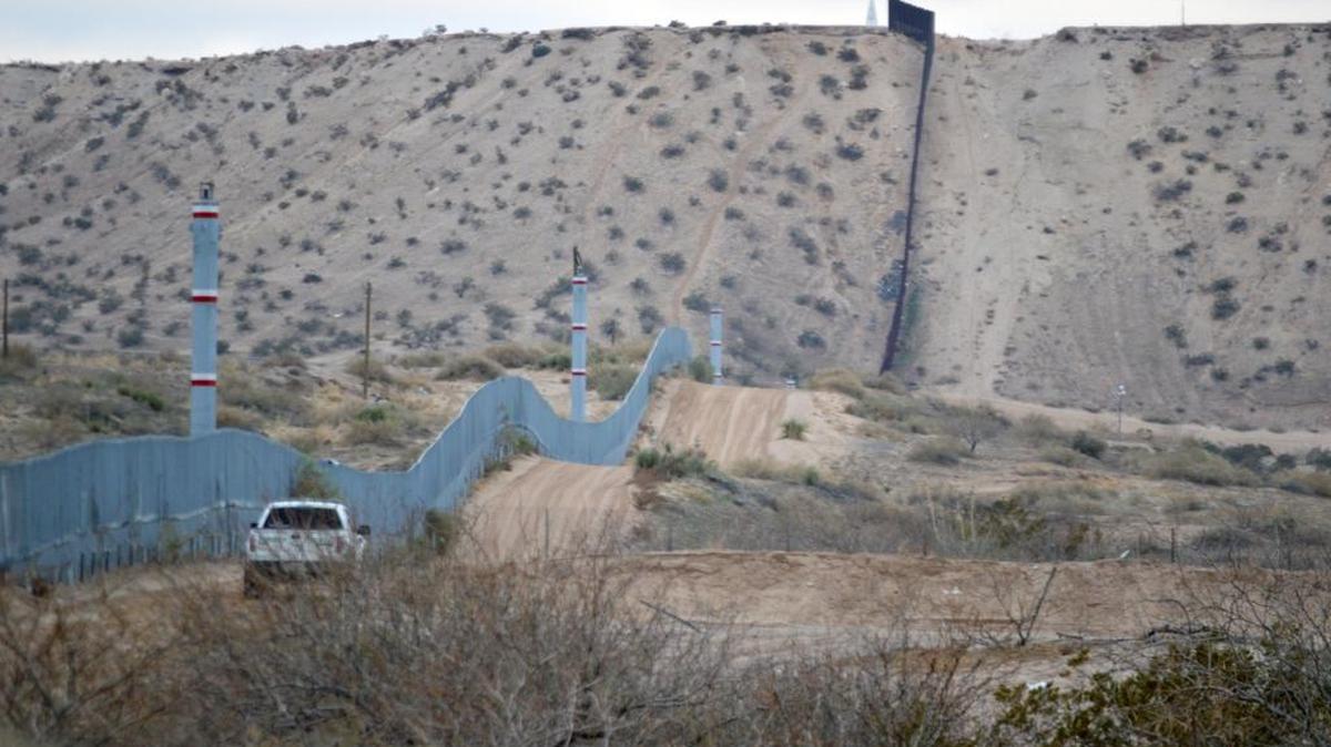 A U.S. Border Patrol agent drives near the U.S.-Mexico border fence in Sunland Park, N.M., on Jan. 4, 2016. A spike in families and children arriving at the U.S. southern border from Central America has prompted fears of another crisis like the one that dominated national news during the summer of 2014.