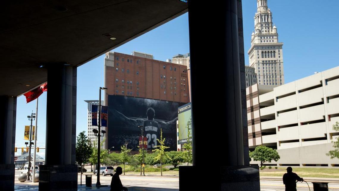 
Workers clean the sidewalk in front of the Quicken Loans Arena in Cleveland on Wednesday.
