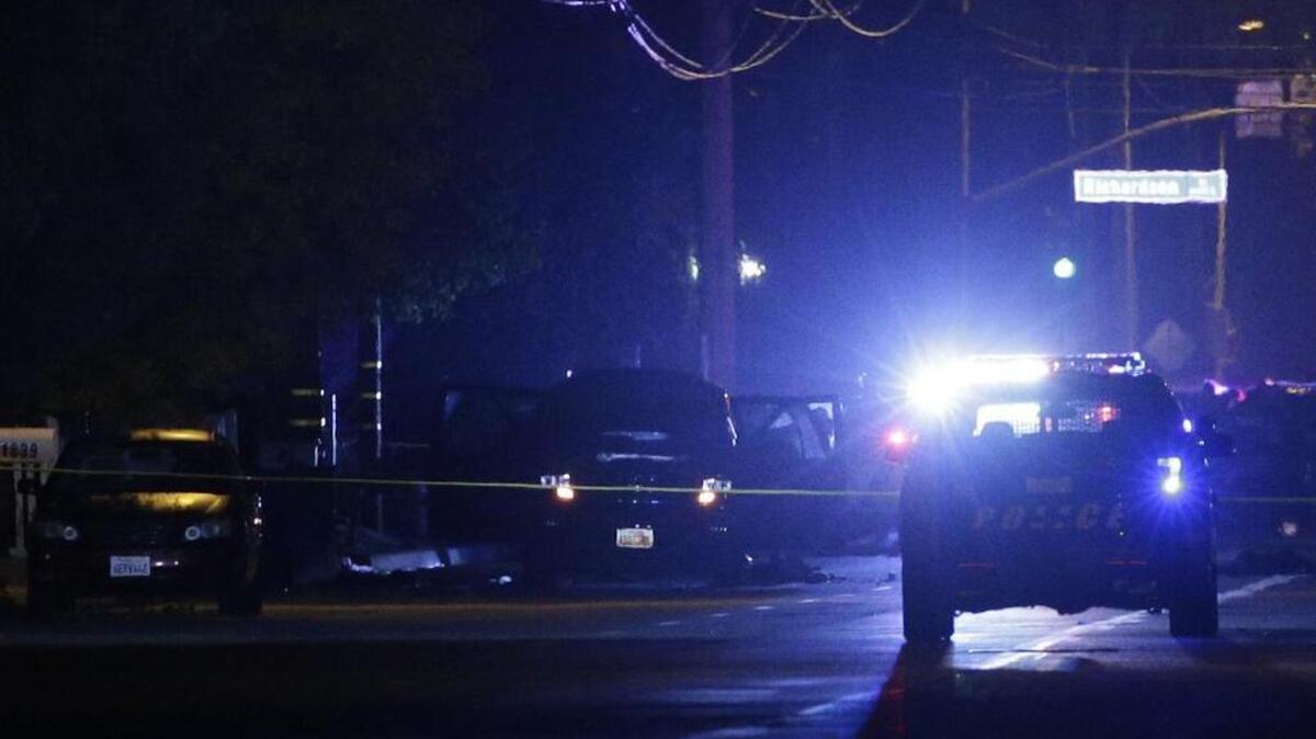Authorities surround the scene following a shootout Wednesday, Dec. 2, 2015, in San Bernardino, Calif. Multiple attackers opened fire on a banquet at a social services center for the disabled in San Bernardino on Wednesday, killing multiple people and sending police on a manhunt for suspects.\