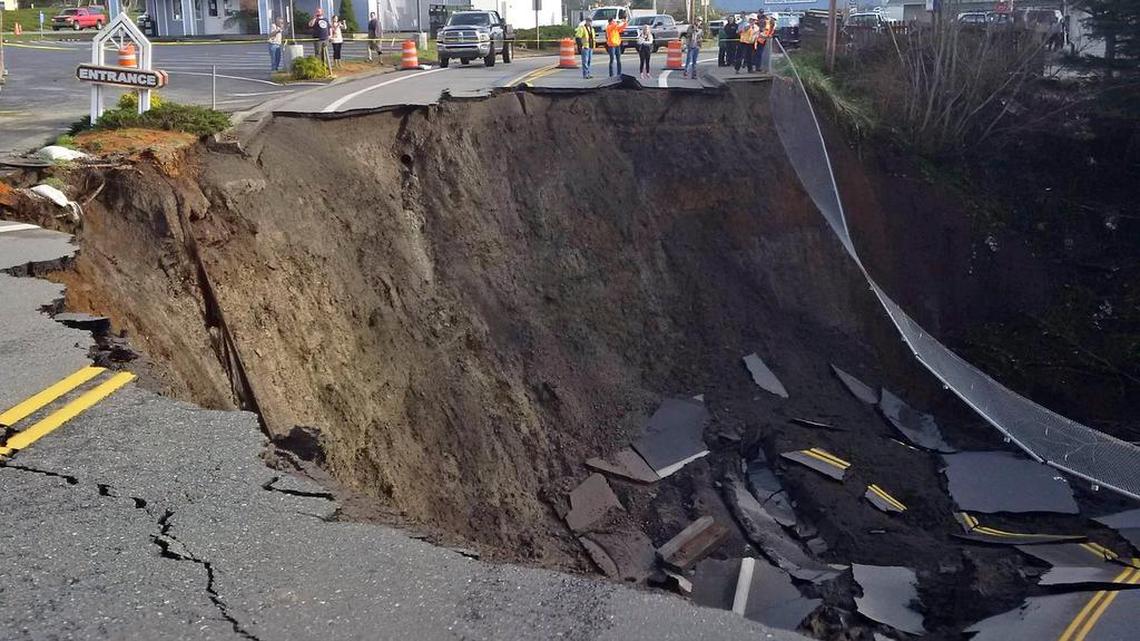 A massive sinkhole has opened up on a road near Highway 101 in the Curry County town of Harbor, Ore. Signs have been placed along the highway directing traffic to a detour.
