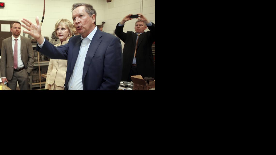 
Ohio Gov. John Kasich speaks with faculty during a tour of the Nashua Community College Precision Manufacturing Program, Tuesday, March 24, 2015, in Nashua, N.H. 
