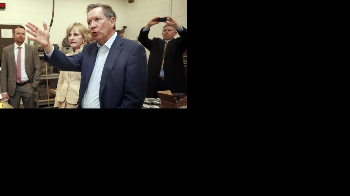 
Ohio Gov. John Kasich speaks with faculty during a tour of the Nashua Community College Precision Manufacturing Program, Tuesday, March 24, 2015, in Nashua, N.H. 
