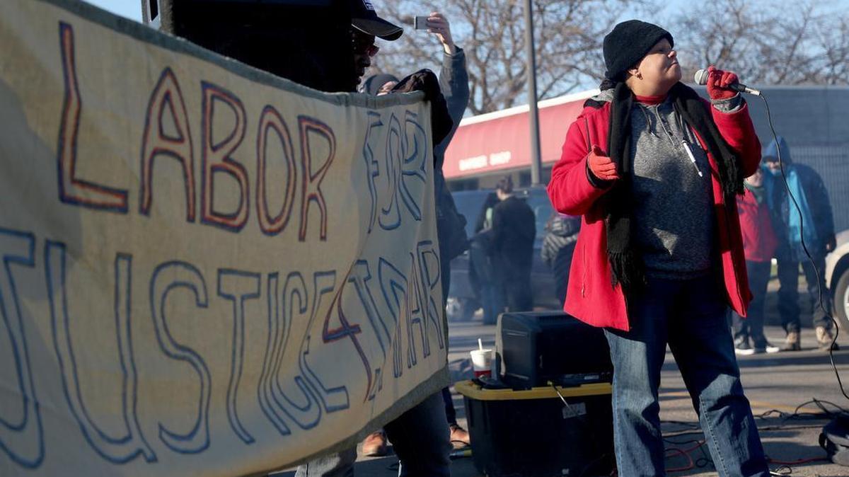 Kerry Jo Felder, secretary for the Minneapolis NAACP, speaks to a crowd of union workers and protesters in front of a police precinct Saturday, Nov. 21, 2015, in Minneapolis. An encampment of protesters outside a Minneapolis police station vowed Saturday to maintain their vigil over the death of a black man who was shot by police, saying they won't move until video recordings of the encounter are released and authorities change how they interact with communities they serve.