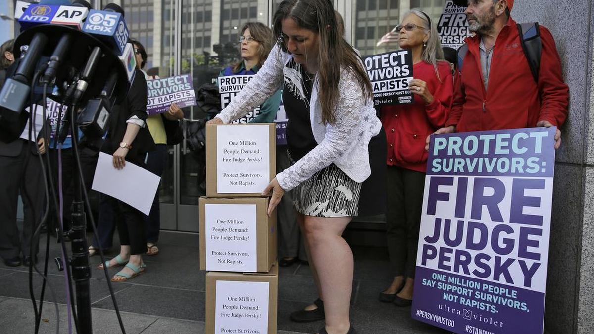 An activist from UltraViolet, a national women’s advocacy organization, stacks boxes containing one million signatures to the California Commission on Judicial Performance calling for the removal of Judge Aaron Persky from the bench during a rally Friday, June 10, 2016, in San Francisco.