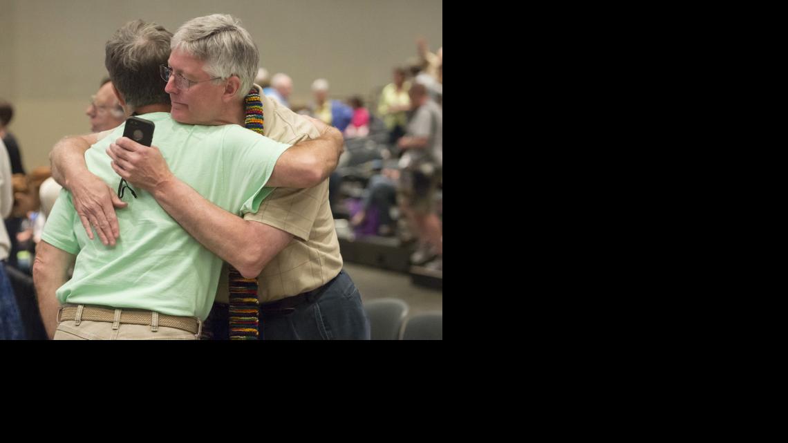 
Gary Lyon, left, of Leechburg, Pa., and Bill Samford of Hawley, Pa., celebrate after a June 19 vote allowing Presbyterian pastors discretion in marrying same-sex couples at the 221st General Assembly of the Presbyterian Church at Cobo Hall in Detroit. The Presbyterian Church (U.S.A.) approved redefining marriage in the church constitution Tuesday to include a “commitment between two people,” becoming the largest Protestant group to formally recognize gay marriage as Christian and allow same-sex weddings in every congregation.
