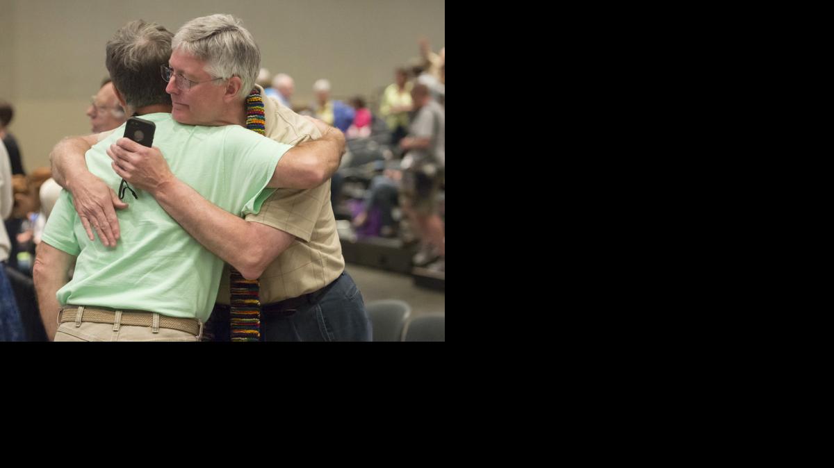
Gary Lyon, left, of Leechburg, Pa., and Bill Samford of Hawley, Pa., celebrate after a June 19 vote allowing Presbyterian pastors discretion in marrying same-sex couples at the 221st General Assembly of the Presbyterian Church at Cobo Hall in Detroit. The Presbyterian Church (U.S.A.) approved redefining marriage in the church constitution Tuesday to include a “commitment between two people,” becoming the largest Protestant group to formally recognize gay marriage as Christian and allow same-sex weddings in every congregation.
