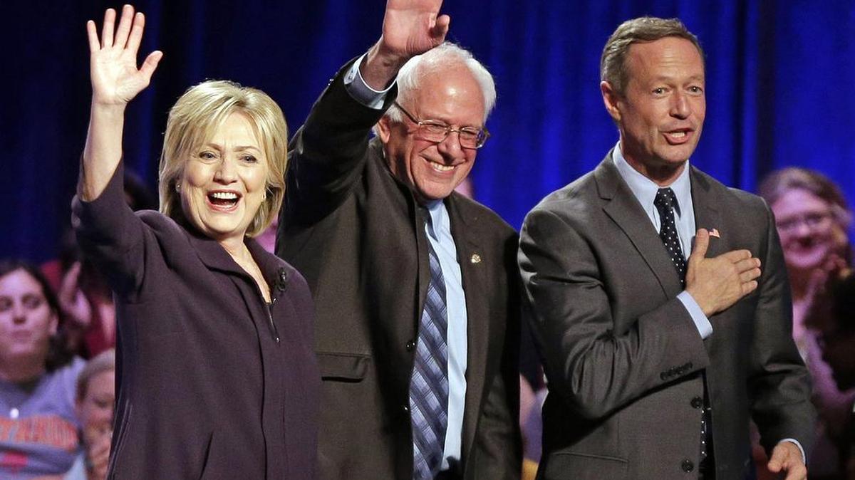 Democratic presidential candidates Hillary Rodham Clinton, left, Sen. Bernie Sanders, I-Vt, center, and former Maryland Gov. Martin O’Malley stand after a democratic presidential candidate forum at Winthrop University in Rock Hill, S.C., on Friday.
