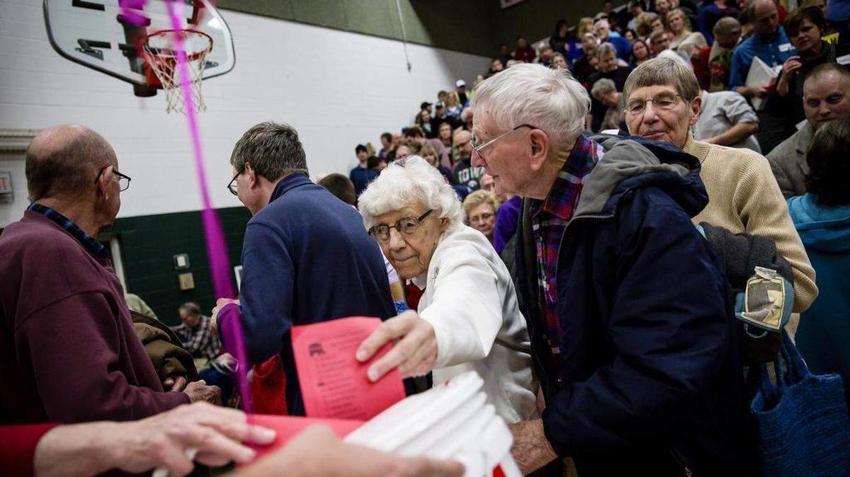 Republican caucus-goers cast their ballots at Pella High School in Pella, Iowa, Feb. 1, 2016. As people from this socially conservative community arrived and checked in, it was quickly apparent many were first-time caucus-goers, with no clear preference among them.
