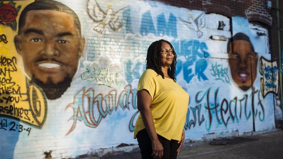 Valerie Dent next to a mural dedicated to her sons, James and Steven, who were killed in a shooting on Sept. 5, 2014, in St. Louis, Oct. 12, 2015. The past decade in Missouri has been a natural experiment in what happens when a state relaxes its gun laws, as the state did in 2007, and one study has found that in the first six years after changes, the gun homicide rate rose by 16 percent, compared to the six years before.