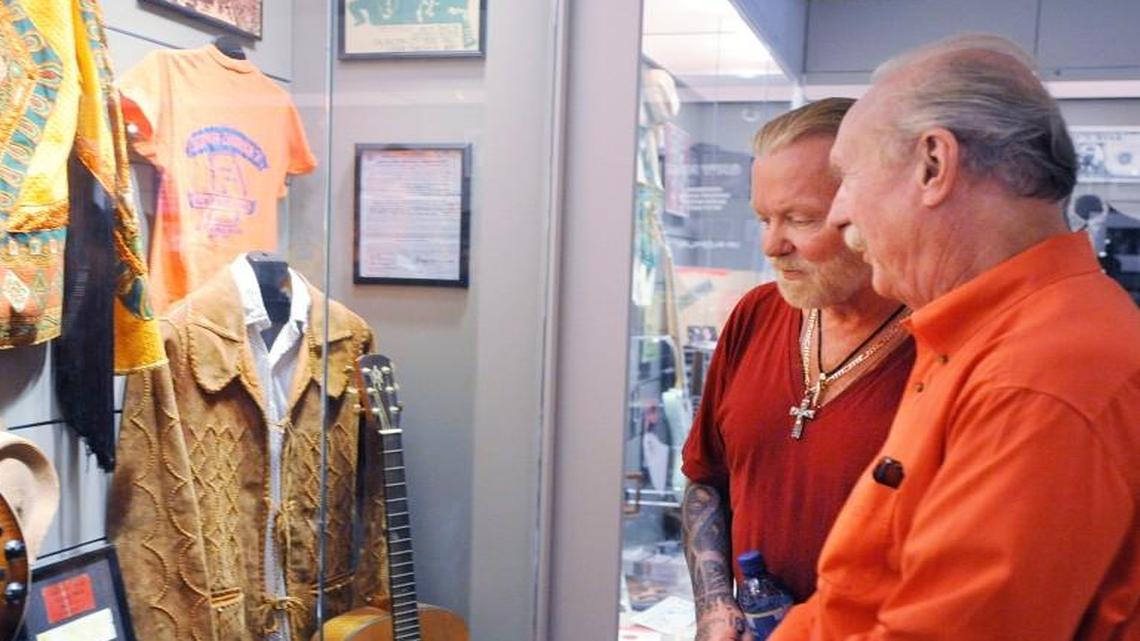 Butch Trucks, right, and Gregg Allman look over display cases at the opening of The Big House Allman Brothers Band Museum in Macon, Ga. on April 23, 2010.