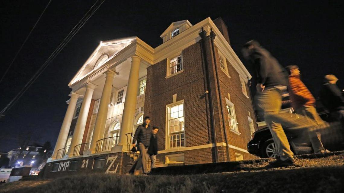In this Jan. 15, 2015 file photo shows students participate in rush pass by the Phi Kappa Psi house at the University of Virginia in Charlottesville, Va. The house was depicted in a debunked Rolling Stone story as the site of a rape in September of 2012. A defamation trial against the magazine followed, over its article about "Jackie" and her harrowing account of being gang raped in a fraternity initiation.