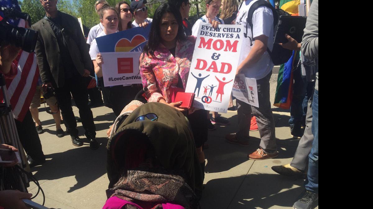 Sara Baquero, a member of Iglesia El Ejercito De Dios in Saugus, Mass., outside the Supreme Court, where she traveled with her family. Her 2-year-old daughter was inside the stroller.