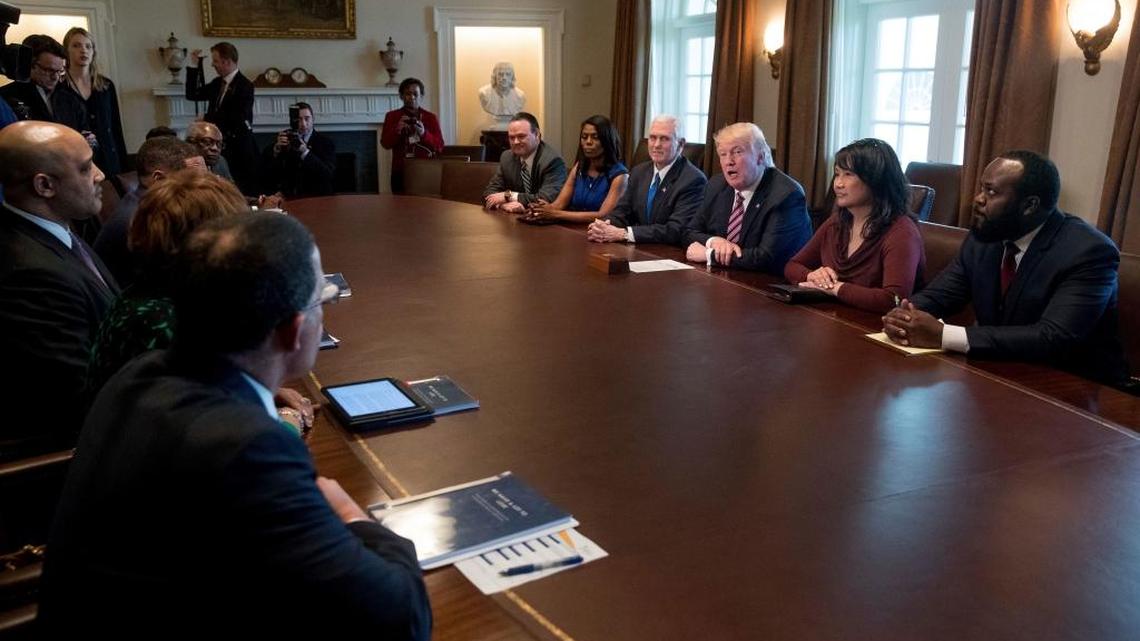 President Donald Trump and Vice President Mike Pence meets with members of the Congressional Black Caucus in the Cabinet Room of the White House in Washington, Wednesday, March 22, 2017. White House Director of communications for the Office of Public Liaison Omarosa Manigault is fifth from right.