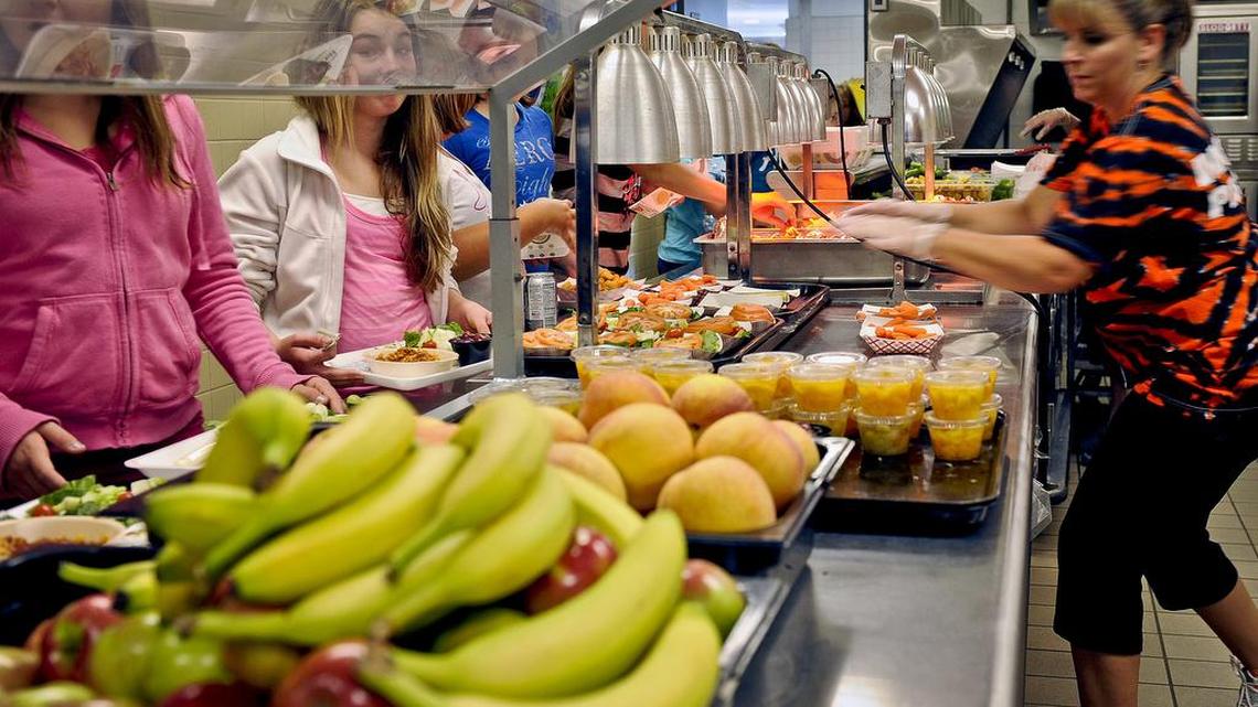 In this Tuesday, Sept. 11, 2012 file photo, students are given healthy choices on a lunch line at Draper Middle School in Rotterdam, N.Y.
